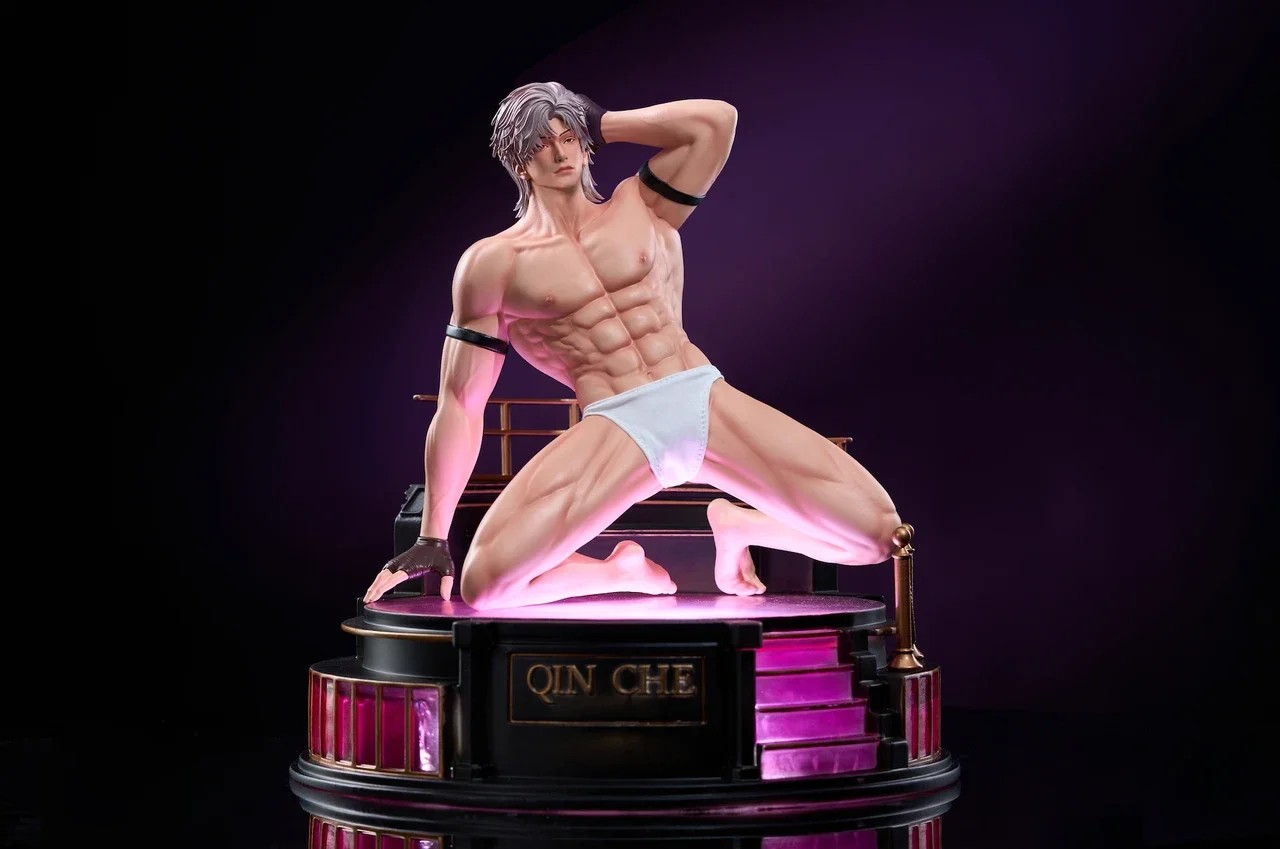 Love and Deepspace Sylus figure in a kneeling pose on a display base
